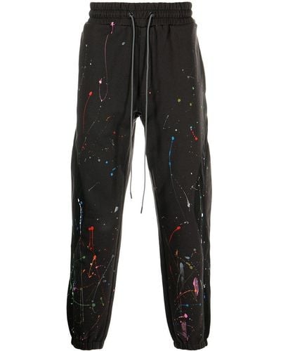 Mostly Heard Rarely Seen Pantalones joggers ajustados con salpicaduras de pintura - Negro