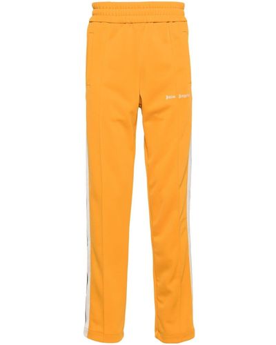 Palm Angels Pantalones de chándal con detalle a rayas - Naranja
