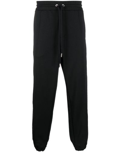 Moncler Pantalones de chándal con rayas laterales - Negro