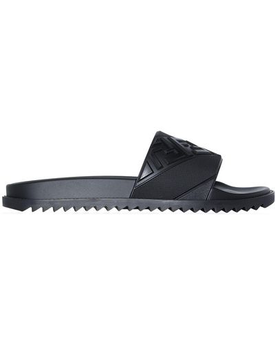 Fendi Sandali slides goffrate con logo FF - Nero