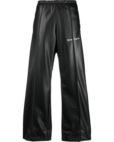Palm Angels Pantalones de chándal Leather Effect con logo estampado - Negro