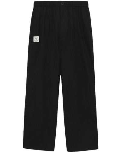 Izzue Pantalon ample à logo appliqué - Noir
