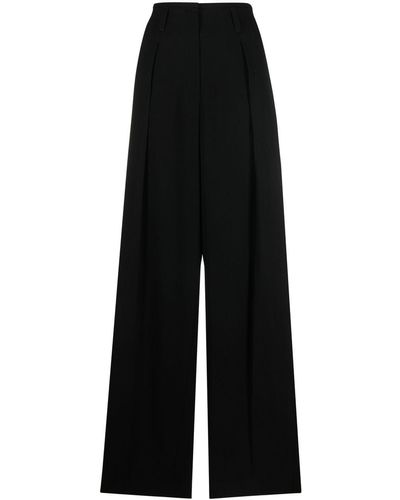 Brunello Cucinelli Pantalones ajustados de talle alto - Negro