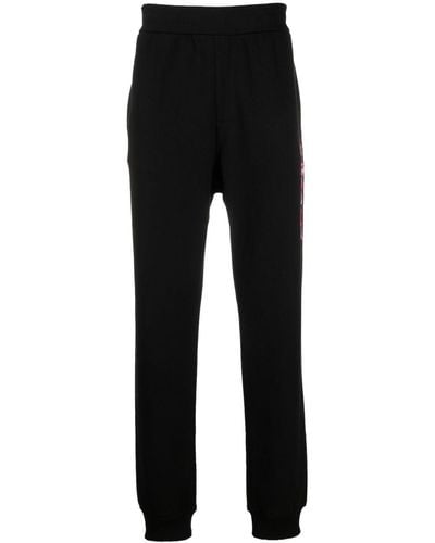 Versace Pantalon de jogging à logo imprimé - Noir