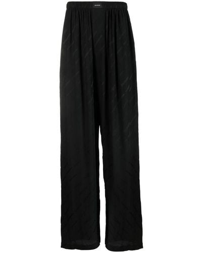 Balenciaga Pantalon de pyjama à logo en jacquard - Noir