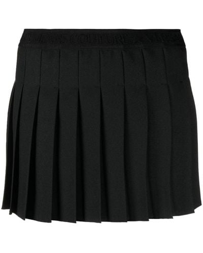 Versace Falda plisada con logo estampado - Negro