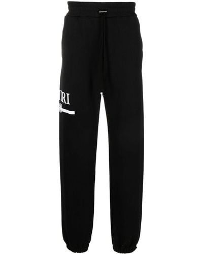 Amiri Pantalon de jogging en coton à logo imprimé - Noir