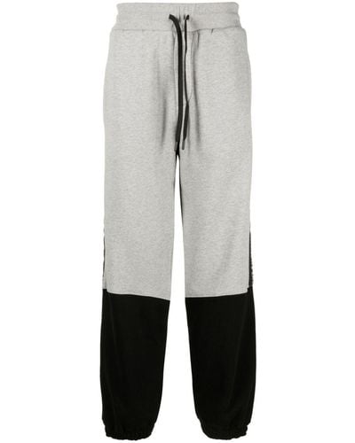 Versace Pantalon de jogging à design bicolore - Blanc