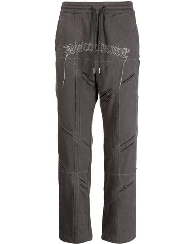 Children of the discordance Logo-embroidered distressed track pant - Grigio