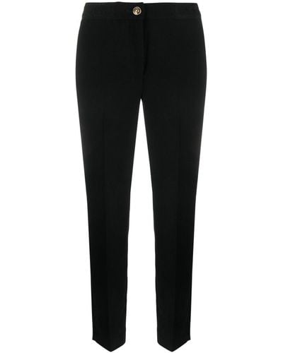 Versace Pantalones slim con logo en la cinturilla - Negro