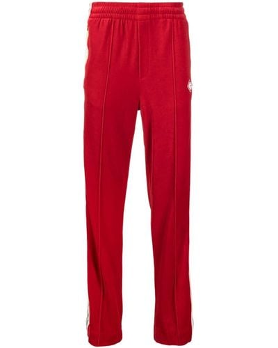 Casablancabrand Pantalones de chándal a rayas con parche del logo - Rojo