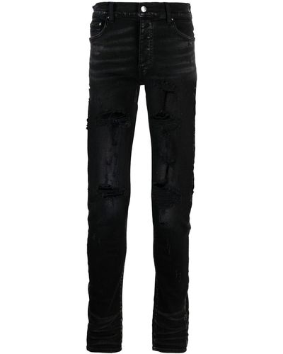 Amiri Jeans skinny con effetto vissuto - Nero