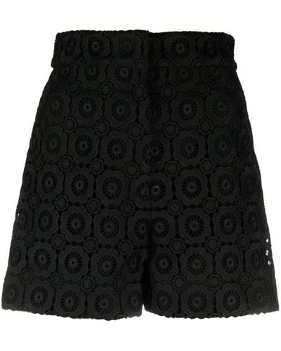 Moschino Shorts con aplique floral - Negro