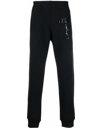 Moschino Logo-print Slim-cut sweatpants - Black