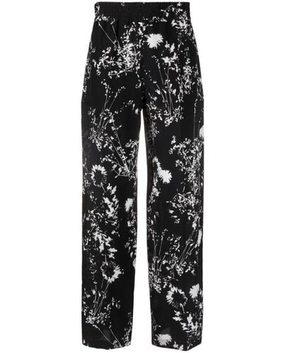 Victoria Beckham Pantalon en soie à fleurs - Noir