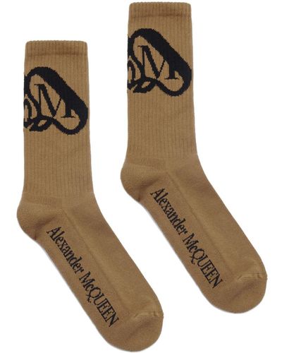 Alexander McQueen Chaussettes nervurées à logo intarsia - Marron