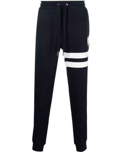 Moncler Pantalon de jogging en coton à patch logo - Bleu