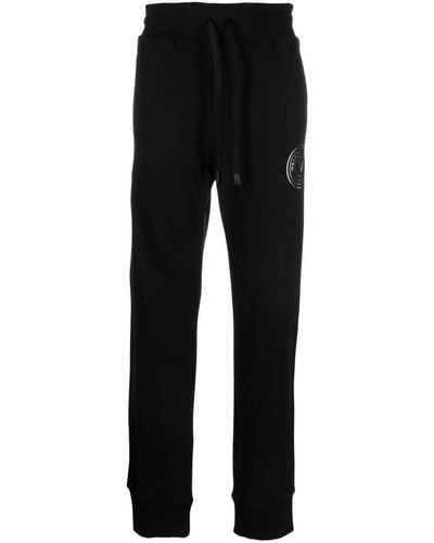 Versace Pantalones de chándal con logo - Negro