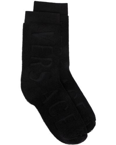 Versace Calcetines con logo en relieve - Negro