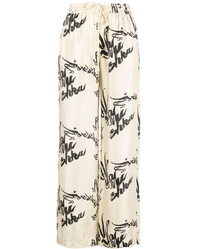 Nanushka Jarine Calligraphy-print Silk Trousers - Natural