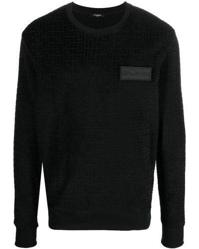 Balmain Sweatshirt in Samtoptik mit Monogramm - Schwarz