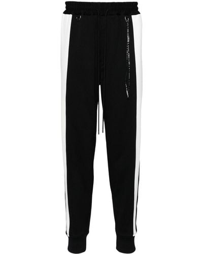 Mastermind Japan Pantalones de chándal con rayas laterales - Negro