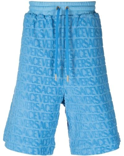Versace Short en éponge à logo Allover embossé - Bleu