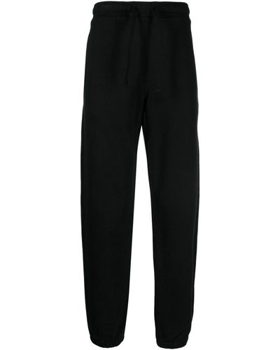 Maharishi Pantalones de chándal con logo bordado - Negro