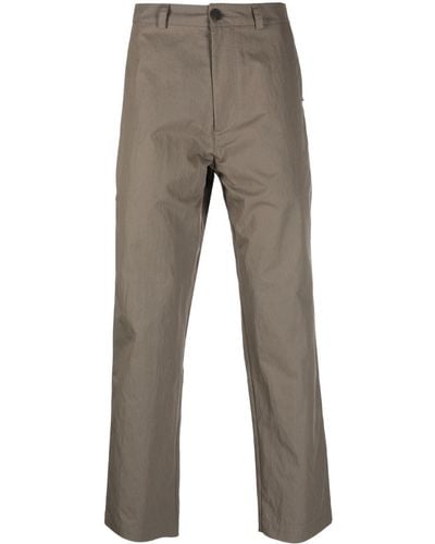 Studio Nicholson Pantalones ajustados Ascent - Gris