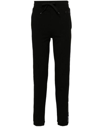 Moschino Pantalones de chándal con franja del logo - Negro
