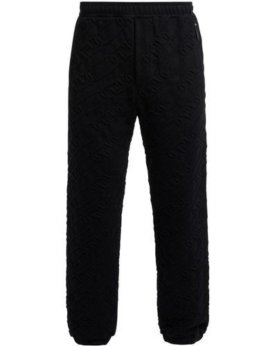 Fendi Pantalones de chándal con logo en relieve - Negro