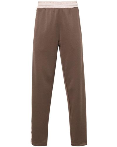 adidas Pantalones de chándal Premium con logo - Marrón
