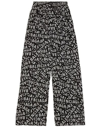 Balenciaga Pantalones anchos con logo estampado - Gris
