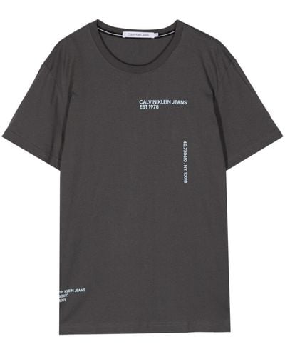Calvin Klein T-shirt en coton à logo imprimé - Noir