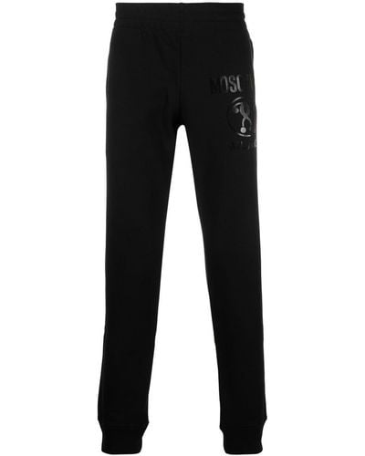 Moschino Pantalon de jogging à logo imprimé - Noir