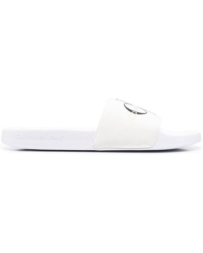 Calvin Klein Sliders bianche con monogramma - Bianco