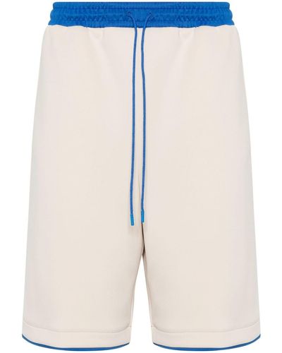 Gucci Pantalones cortos de deporte con aplique del logo - Azul