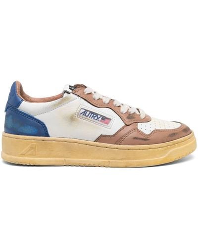 Autry Sneakers blancas vintage con tacón azul
