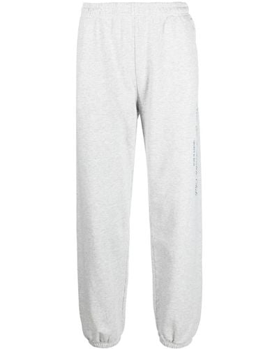 Sporty & Rich Pantalones de chándal elásticos con logo estampado - Blanco