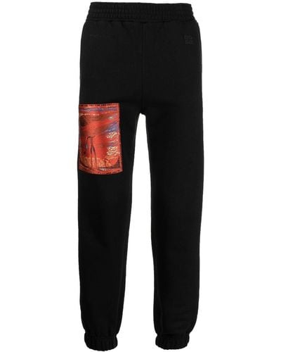 Givenchy Pantalones de chándal con detalle de parche - Negro