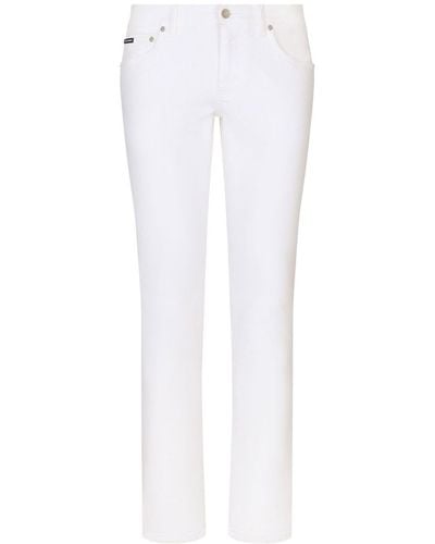 Dolce & Gabbana Jeans skinny con placca logo - Bianco