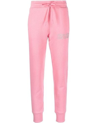 Versace Pantaloni fitness rosa con logo ricamato
