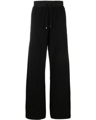 Saint Laurent Pantalon de jogging en coton à coupe ample - Noir