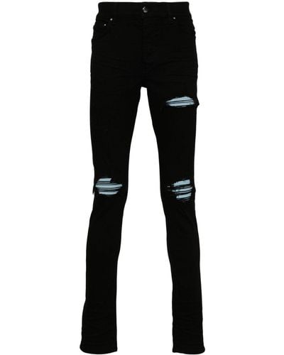 Amiri Jeans skinny con effetto vissuto MX1 - Nero