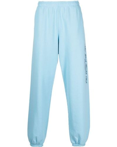 Sporty & Rich Pantalon de jogging en coton à logo imprimé - Bleu