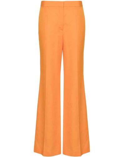 Stella McCartney Pantalones acampanados de talle medio - Naranja