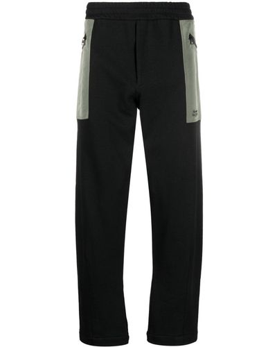 Alexander McQueen Pantalon de jogging en coton à poches contrastantes - Noir