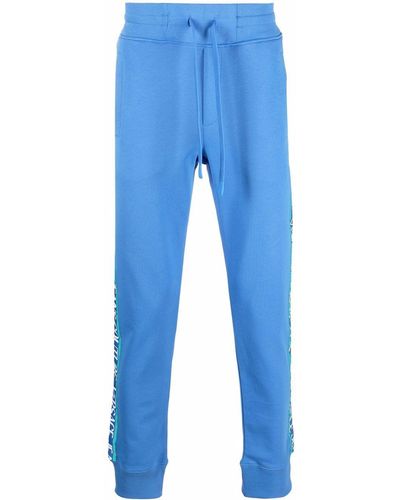 Versace Pantalones joggers con ribete de logo - Azul