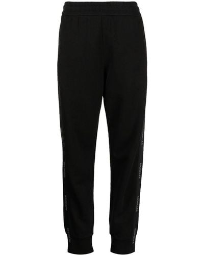 Moncler Pantalon de jogging en coton à bandes logo - Noir