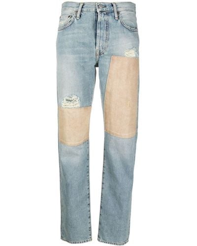 Acne Studios Jeans affusolati con applicazione - Blu